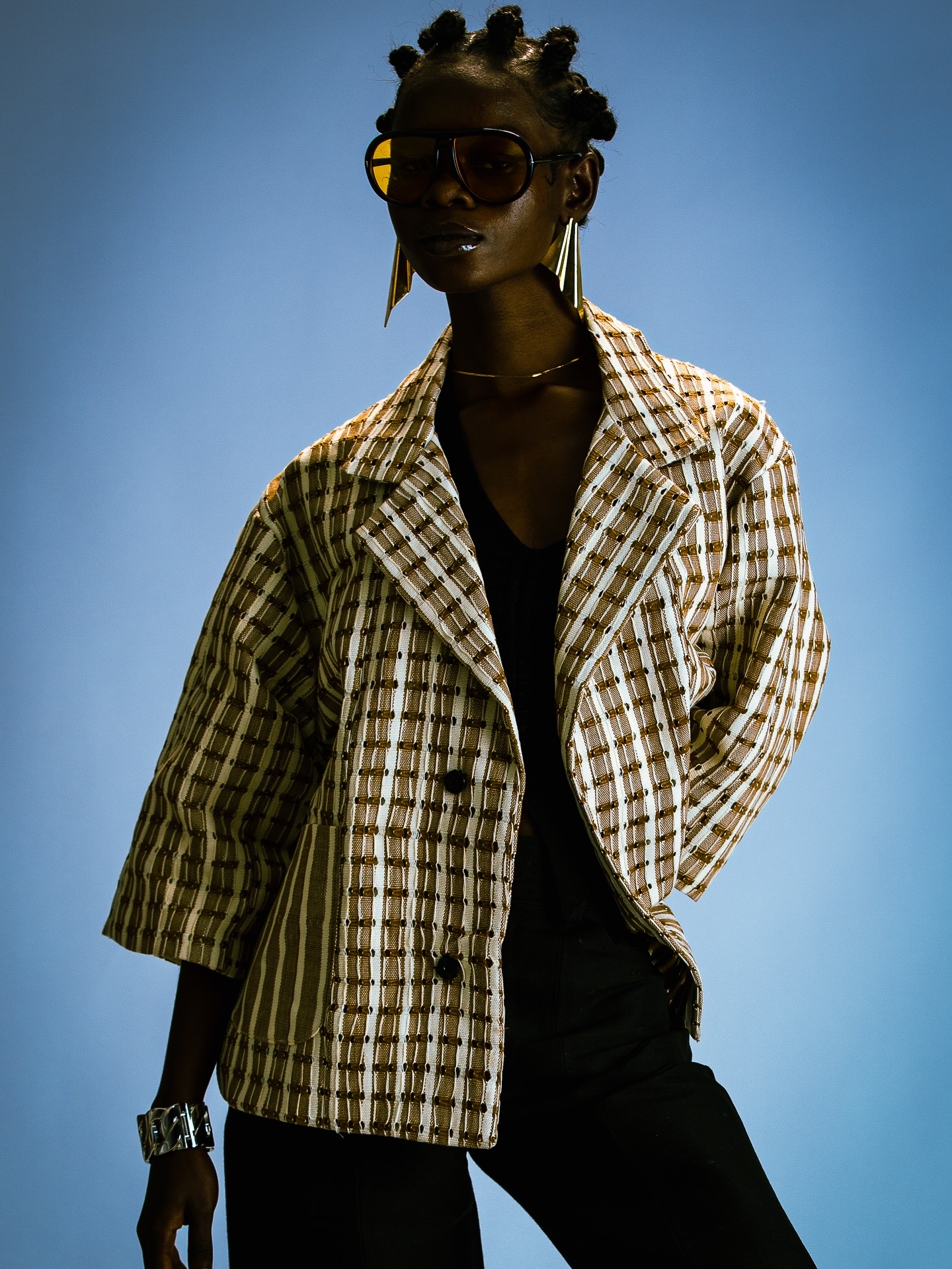 Woven from natural Aso-Oke, the Sandstone Jacket is a study in strength and ease. Its sandy palette and clean stripes explores the modern, versatile, and unapologetically African style . Unisex by design, the Sandstone Jacket brings heritage into a shared space. “For him. For her. For all.”